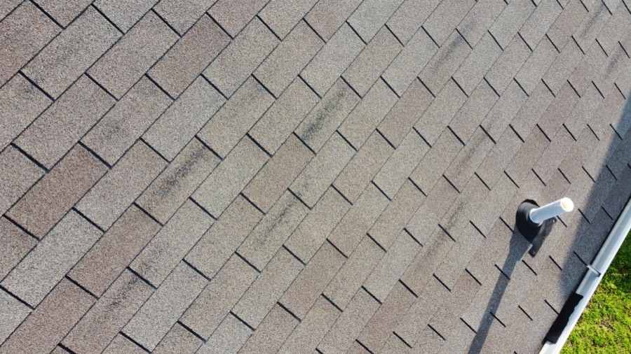Drone view of a shingle roof and ridge line